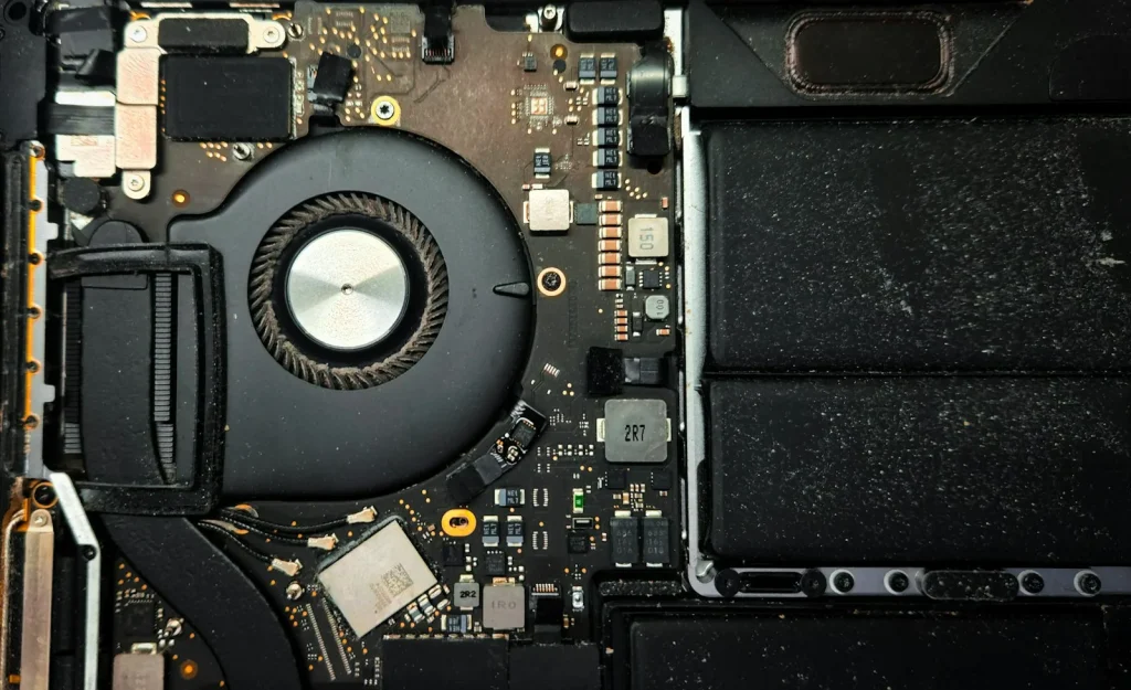 Inside a laptop: cooling fan and internal components