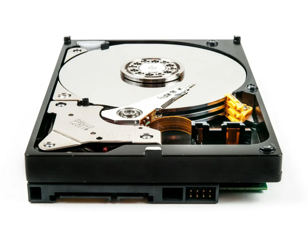 Opened hard drive showing the platter and read arm