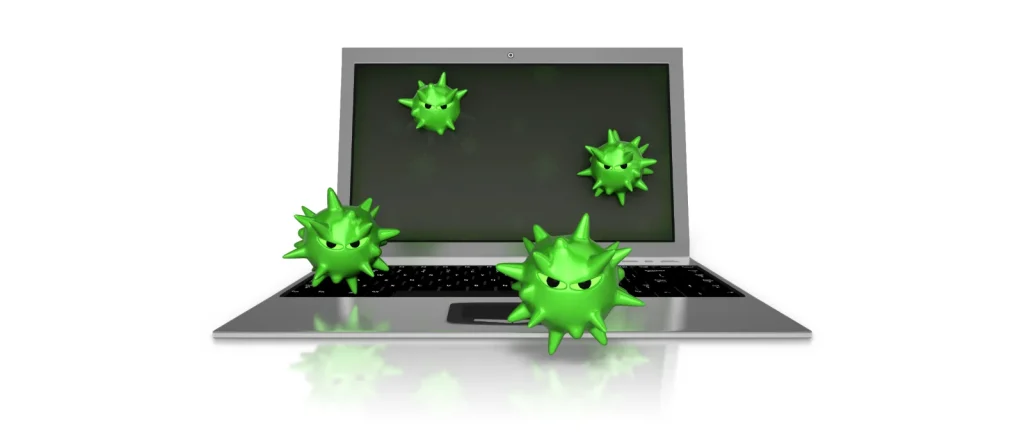 Laptop with green virus icons on the screen